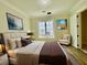 Spacious bedroom with hardwood floors, window, and an armchair at 4412 Brookview Se Dr, Atlanta, GA 30339