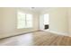 Well-lit bedroom with hardwood floors and a view of the backyard at 4412 Brookview Se Dr, Atlanta, GA 30339