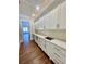 Elegant butler's pantry featuring custom white cabinetry and quartz countertops at 4412 Brookview Se Dr, Atlanta, GA 30339