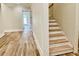 Light-filled hallway with hardwood floors and staircase at 4412 Brookview Se Dr, Atlanta, GA 30339