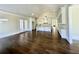 Open concept kitchen with white cabinets, large island, and hardwood floors at 4412 Brookview Se Dr, Atlanta, GA 30339