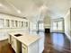 Open concept kitchen with white cabinets, large island, and hardwood floors at 4412 Brookview Se Dr, Atlanta, GA 30339