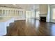 Open concept kitchen with white cabinets, large island, and hardwood floors at 4412 Brookview Se Dr, Atlanta, GA 30339