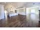 Open concept kitchen with white cabinets, large island, and hardwood floors at 4412 Brookview Se Dr, Atlanta, GA 30339