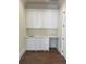 Laundry room with white cabinets and hardwood floors at 4412 Brookview Se Dr, Atlanta, GA 30339