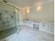 Luxurious bathroom featuring double vanities, a large shower, and marble accents at 4412 Brookview Se Dr, Atlanta, GA 30339