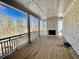 Covered porch with stone fireplace and wooden flooring at 4412 Brookview Se Dr, Atlanta, GA 30339