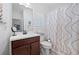 Clean bathroom with a single vanity, shower/tub combo, and neutral decor at 4980 Pleasantry Nw Way, Acworth, GA 30101