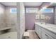 Elegant bathroom with double vanity, large shower, and decorative tile at 4980 Pleasantry Nw Way, Acworth, GA 30101