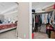 Another walk-in closet with hanging space and shelves at 4980 Pleasantry Nw Way, Acworth, GA 30101