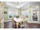 Bright dining room features a large table, hardwood floors, and access to a patio at 4980 Pleasantry Nw Way, Acworth, GA 30101