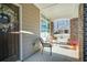 Covered front porch with wooden door and charming wreath at 4980 Pleasantry Nw Way, Acworth, GA 30101