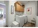 Convenient laundry room with washer, dryer, and cabinets at 4980 Pleasantry Nw Way, Acworth, GA 30101