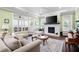Relaxing living room with fireplace, ample seating and large windows offering natural light at 4980 Pleasantry Nw Way, Acworth, GA 30101