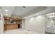 Spacious finished basement with bar area and an adjacent bathroom at 5025 Hidden Ct, Cumming, GA 30040