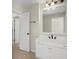 Bathroom with a white vanity, drawers, and a large mirror at 5025 Hidden Ct, Cumming, GA 30040