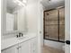 Bathroom with a white vanity, drawers, and a shower/tub combo at 5025 Hidden Ct, Cumming, GA 30040
