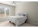 Bedroom featuring a bed with pillows, a window, and carpet at 5025 Hidden Ct, Cumming, GA 30040