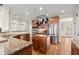 Well-equipped kitchen boasts stainless steel appliances, granite countertops, and ample cabinet space at 5025 Hidden Ct, Cumming, GA 30040