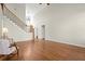 Spacious living room features hardwood floors, high ceilings, and a staircase with iron railings at 5025 Hidden Ct, Cumming, GA 30040