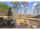 Cozy outdoor patio with table and chairs, shaded by an umbrella at 5025 Hidden Ct, Cumming, GA 30040