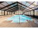 Large enclosed in-ground pool featuring slide at 5025 Hidden Ct, Cumming, GA 30040
