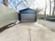 Detached garage with gray door and blue exterior at 1342 Lucile Sw Ave, Atlanta, GA 30310