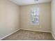 Small bedroom with neutral walls and carpeted floor at 3794 Whaley Ct, Snellville, GA 30039