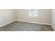Small bedroom with window and carpet flooring at 3794 Whaley Ct, Snellville, GA 30039