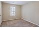 Bright bedroom featuring a window and carpet flooring at 3794 Whaley Ct, Snellville, GA 30039