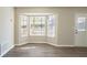 Dining room with bay window and wood-look floors at 3794 Whaley Ct, Snellville, GA 30039