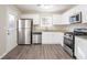 Kitchen with stainless steel appliances and white cabinets at 3794 Whaley Ct, Snellville, GA 30039