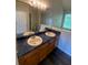 Double vanity bathroom with blue countertop and vinyl flooring at 2080 Winding Crossing Trl, Fairburn, GA 30213