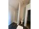Bright bathroom features a shower and modern toilet with wood-look flooring at 2080 Winding Crossing Trl, Fairburn, GA 30213