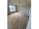 Spacious bedroom with large window and neutral carpeting at 2080 Winding Crossing Trl, Fairburn, GA 30213