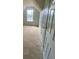 Bedroom with sloped ceiling, carpet flooring and natural lighting at 2080 Winding Crossing Trl, Fairburn, GA 30213