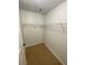 Walk-in closet with carpet flooring, white wire shelving, and white walls at 2080 Winding Crossing Trl, Fairburn, GA 30213