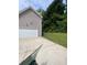 Exterior view of a house with a driveway and an attached garage at 2080 Winding Crossing Trl, Fairburn, GA 30213