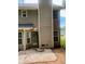 Rear exterior view of a house showing the back door and patio at 2080 Winding Crossing Trl, Fairburn, GA 30213
