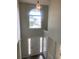 Bright foyer features a high ceiling, a large arched window, and neutral wall paint at 2080 Winding Crossing Trl, Fairburn, GA 30213