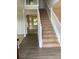 Foyer with hardwood floors and a staircase leading to the upper level at 2080 Winding Crossing Trl, Fairburn, GA 30213