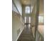 Bright entryway with hardwood floors, and a staircase, leading into carpeted living space at 2080 Winding Crossing Trl, Fairburn, GA 30213