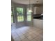 Breakfast nook with large windows offering backyard views and tile flooring at 2080 Winding Crossing Trl, Fairburn, GA 30213