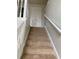 Carpeted stairs with white handrails lead to the upper level of the home at 2080 Winding Crossing Trl, Fairburn, GA 30213