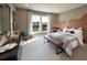 Cozy bedroom featuring a large window, natural light, and comfortable furnishings at 6745 Dahlgren Ct, Cumming, GA 30028