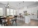 Eat-in kitchen features bright natural light, a center island, and stainless steel appliances at 6745 Dahlgren Ct, Cumming, GA 30028