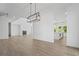 Bright living room featuring a fireplace, hardwood floors, and an open layout at 6745 Dahlgren Ct, Cumming, GA 30028