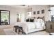 Bright main bedroom with white decor, modern furnishings and lots of light at 6745 Dahlgren Ct, Cumming, GA 30028