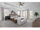 Spacious main bedroom with tray ceiling, plush carpeting, and lots of natural light at 6745 Dahlgren Ct, Cumming, GA 30028
