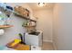 Bright laundry room with washer, dryer, and ample shelving at 234 Fieldbrook Xing, Canton, GA 30115